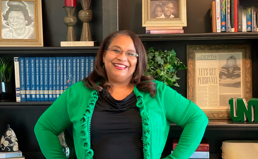 Donna Asher smiling in her office